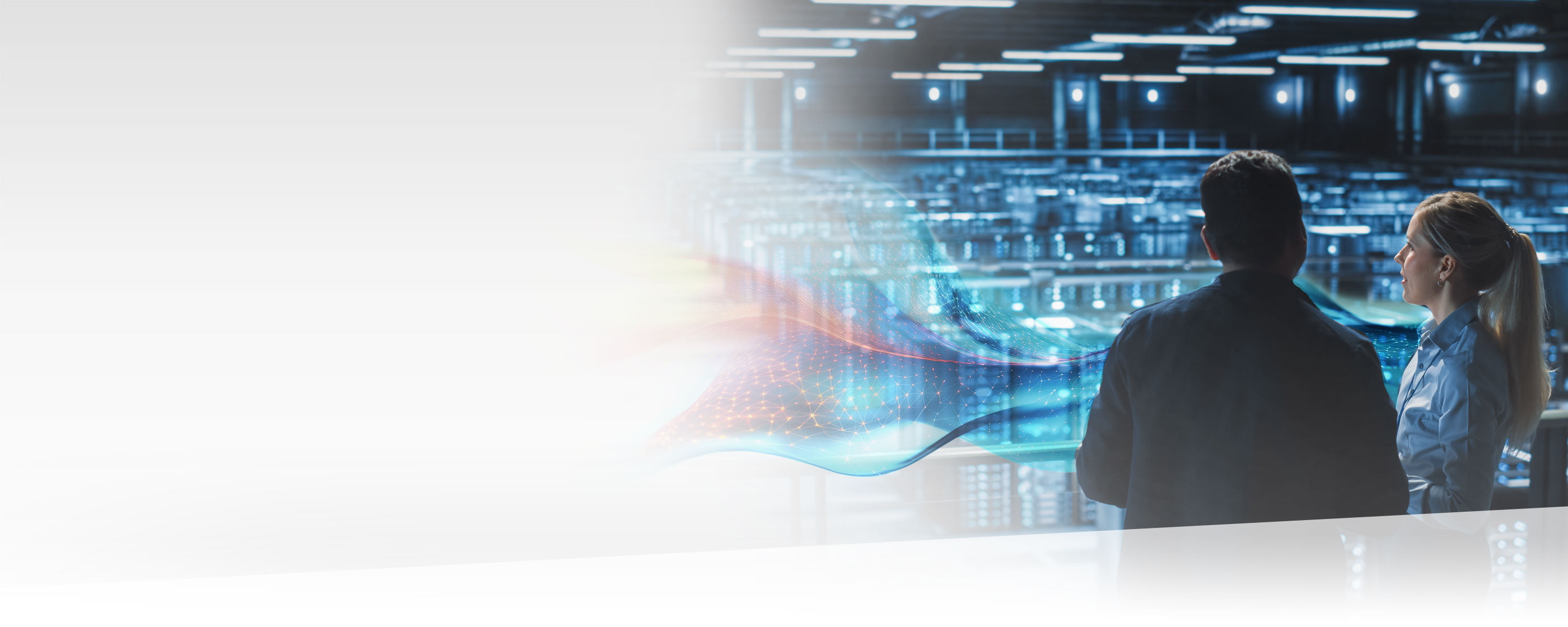 Two workers inside a data centre